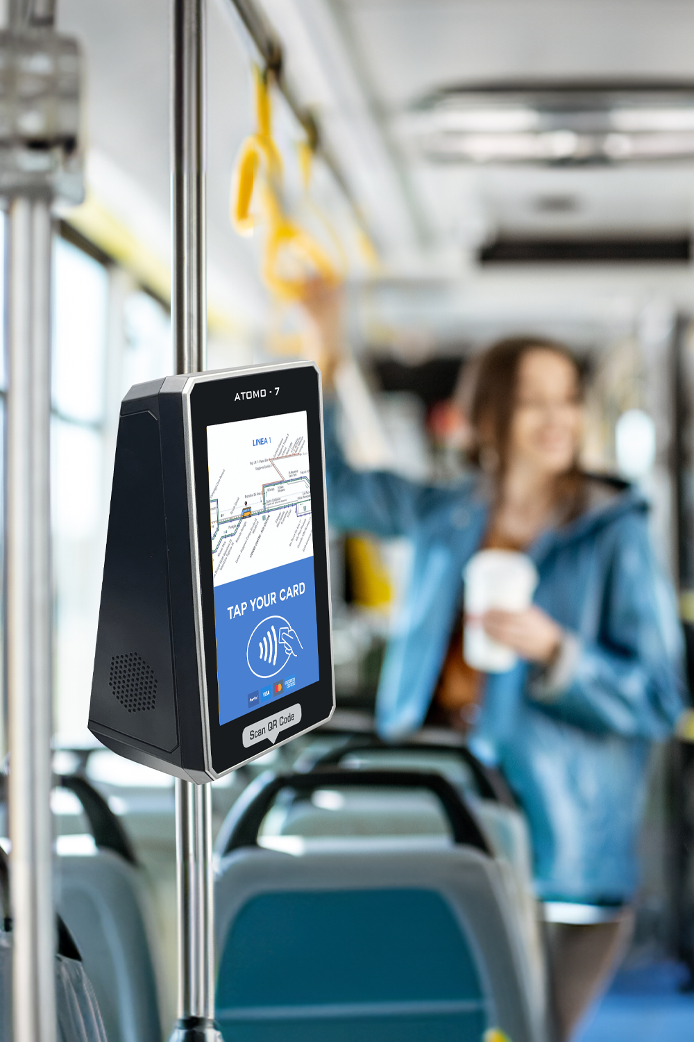 digitax atomo7 smart ticketing validator mounted on pole inside a public bus