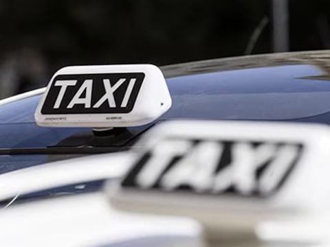 taxi roof sign installed on top of a car